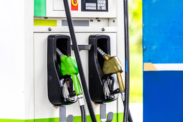 Close up fuel nozzle of gas station. Colorful gas station nozzle