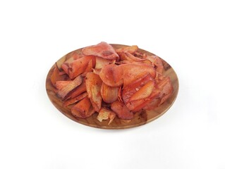 Keripik singkong or cassava chips sweet and spicy on plate isolated on white background. High angle...