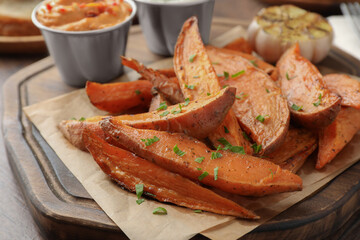 Tasty cooked sweet potatoes on table, closeup