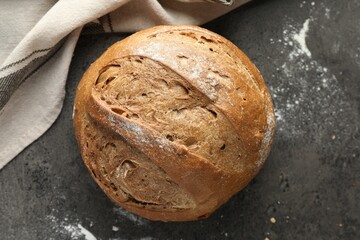 Freshly baked bread on grey table, top view