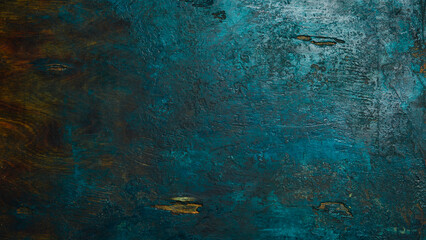 Grunge dark turquoise textured background. Stone surface in green and turquoise colors. Free space for text or design. Top view.
