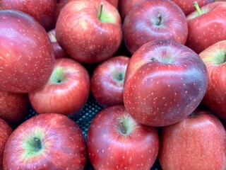 (Malus domestica) or Apples in the supermarket. Delicious red apples. Healthy diet food concept. Top view. 