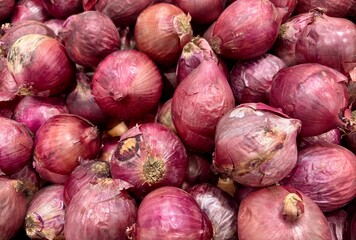 Onion. Fresh Red Onions on a Farmers Market.
Red Onions texture background.