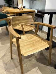 Wooden furniture in a cafe or coffee shop. Wooden armchair. Vertical