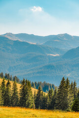 Romania Transalpina road with many serpentines crossing forest in  Carpathian mountains. Mountains...