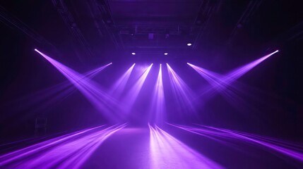 Purple stage lights illuminating a dark empty space.