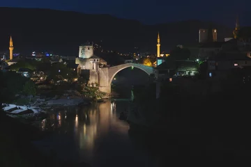 Historical Mostar Bridge, 16th-century Ottoman Bridge at night, also known as Stari Most or Old Bridge in Mostar, Bosnia Herzegovina 