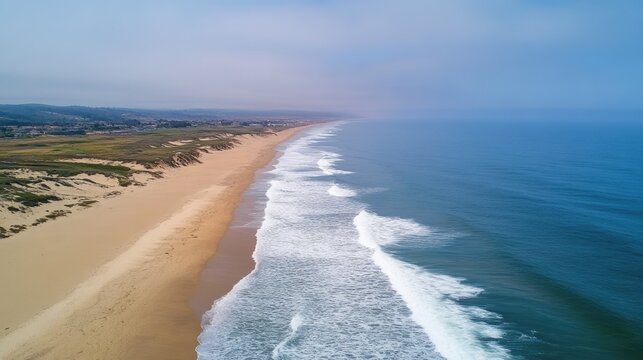 Aerial shot of ocean waves gently rolling onto a remote, golden beach. - Powered by Adobe