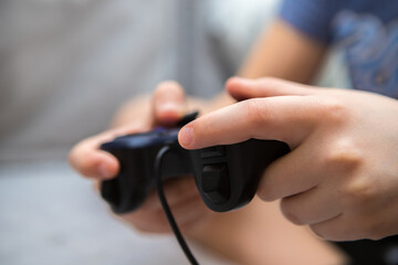 boy's hands with gamepad close up