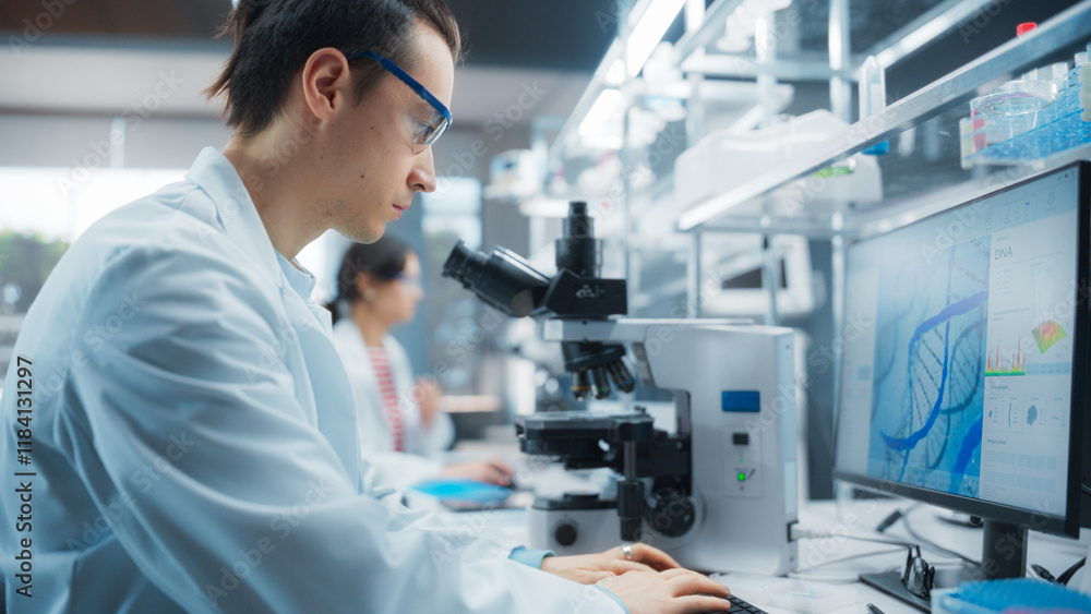 Poster portrait of a young graduate student working in a laboratory, using advanced microscope, writing dow