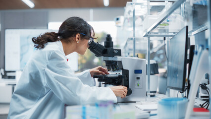 Portrait of a Beautiful Caucasian Student Working on a Research Project in College. Medical...