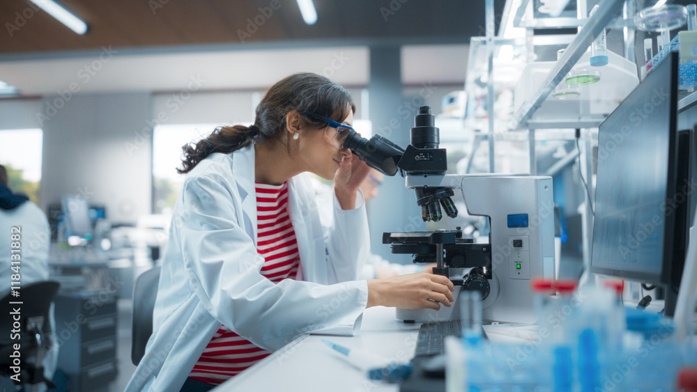 Poster medical research scientist looking at biological samples under a microscope in an applied science la