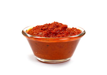 Ajvar isolated on white- traditional macedonian serbian dish made from red bell peppers, eggplant and garlic, lutenitza, popular in Balkans. Homemade tomato sauce for pasta.