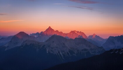 Obraz premium Majestic Sunrise Illuminates Mountain Peaks 