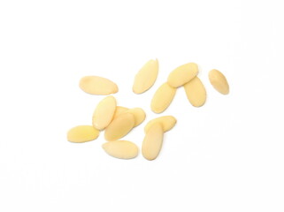 Heap of raw almond flakes isolated on white background. Sliced almonds pile.  Peeled or hulled...