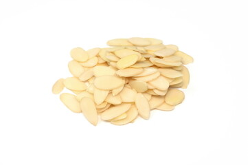 Heap of raw almond flakes isolated on white background. Sliced almonds pile.  Peeled or hulled almond slices pile isolated.
