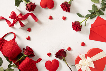 Valentine's day romantic frame with red lace bustier underwear, gifts, candy sweets and red roses...