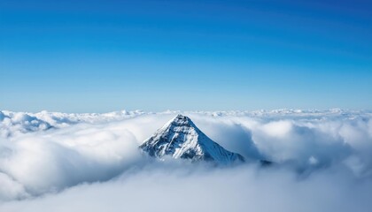 A lone mountain peak above the clouds, symbolizing resilience and achievement