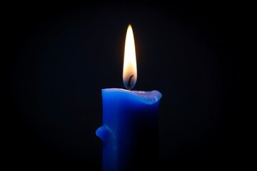 Blue Candle Light Isolated with blue and black background.