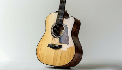 Obraz premium a light ivory guitar lying on a light white background