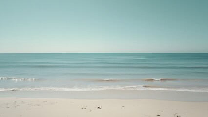 Obraz premium Serene Minimalist Beach Scene, Calm Sea, Clear Blue Sky in Gray Tones - Travel Inspiration