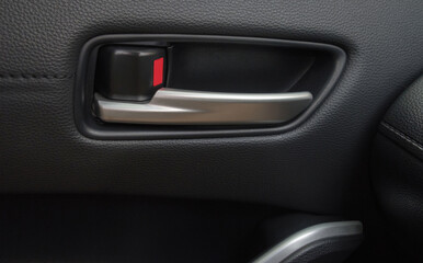 Car door interior handle closeup