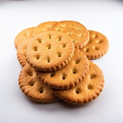 Close-up of golden, crispy biscuits creaker neatly on a white background; food concept