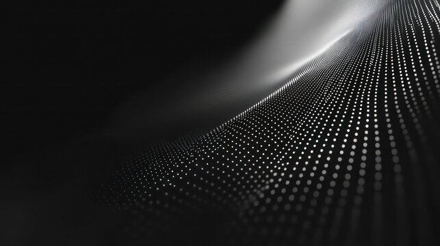 Abstract grayscale wave of light dots on dark background.