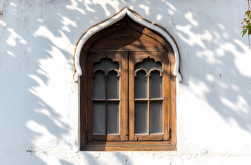 A window with a wooden frame and a white frame