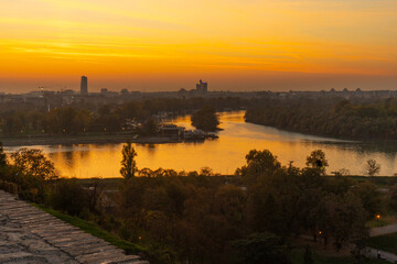 Fototapeta premium Sunset panoramic view of Sava and Danube rivers confluence with New Belgrade skyline, Serbia 