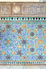 Mosaic tiles in Patio de las Doncellas (Courtyard of the Maidens) in Alcazar of Seville, Andalusia, Spain. Mudejar Palace of Reales Alcazares. Azulejos alicatados of Al Andalus