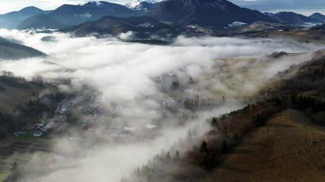 Aerial View of a Beautiful Misty Village in the Valley of the Carpathian Mountains, Slovakia
