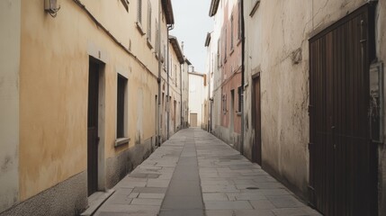 Obraz premium Narrow, quiet street in old town with aged buildings.