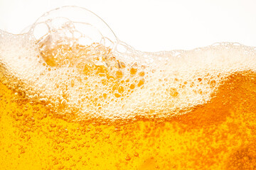Close up bright orange Oil or beer splash texture and nature waves, Beautiful waves curve and little bubbles smooth for graphic design and background, Oil Bubbles, Soft beer bubbles, Selective focus