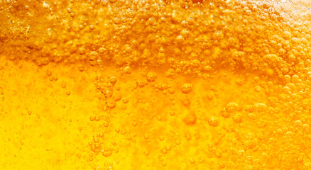 Close up bright orange Oil or beer splash texture and nature waves, Beautiful waves curve and...