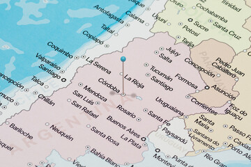 Macro photo of a light blue pin needle into Cordoba city of Argentina political map 