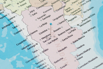 Macro photo of a light blue pin needle into San Luis city of Argentina political map 
