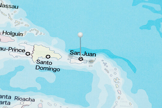 Macro photo of a white pin needle into San Juan city of Puerto Rico political map 
