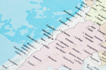 Fototapeta premium Macro photo of a white pin needle into Santiago city of Chile political map
