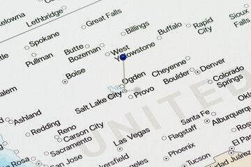 Macro photo of a blue pin needle into Salt Lake City city of United States of America political map 