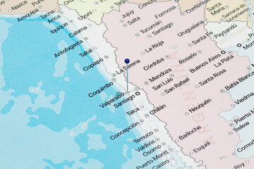 Macro photo of a blue pin needle into Valparaiso city of Chile political map