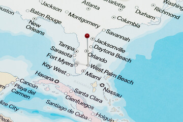 Macro photo of a red pin needle into West Palm Beach city of United States of America political map 