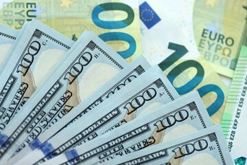 Big pile of Euro and USD banknotes. Many european and united states dollars