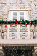 Decorated balcony in an old Mediterranean town.
Building in old mediterranean town with Christmas...