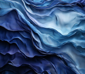 A soft, silky navy blue fabric with folds and wavy patterns, gently flowing to create a luxurious gradient of dark and light blues.