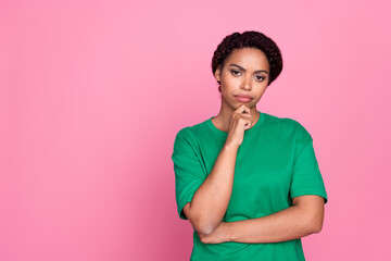 Photo portrait of pretty young girl thinking skeptical wear trendy green outfit isolated on pink...