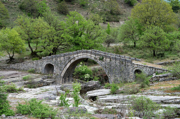Fototapeta premium View of the traditional stone Bridge of Greci in Epirus, Greece in Spring.