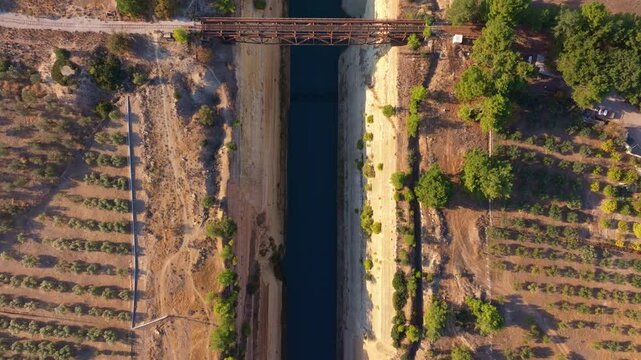 Aerial view of Corinth Canal with scenic bridge and beautiful landscape, Corinth, Greece.
