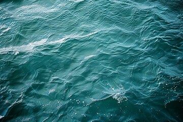 Fototapeta premium Photo of Waves of water of the river and the sea. Background texture for backdrops or mapping