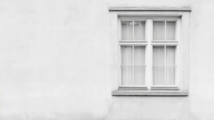 Single white window on a textured wall.
